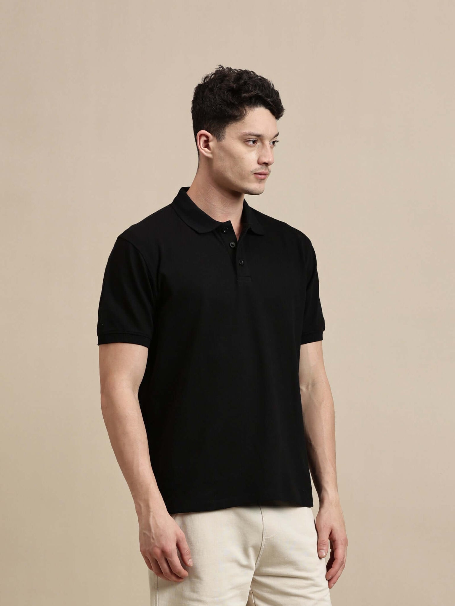 Men's Polo – Half Sleeve - Basic Polo Solid Regular Fit displayed in black, showcasing its snug fit and premium fabric.