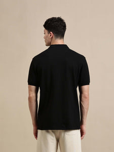 Men's Polo – Half Sleeve - Basic Polo Solid Regular Fit - Back view of a man wearing a black polo shirt.