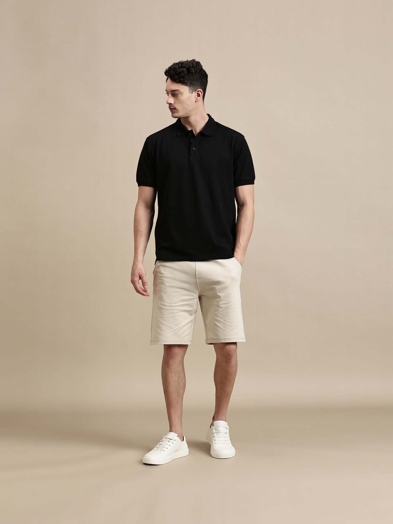 Men's Polo – Half Sleeve - Basic Polo Solid Regular Fit worn by model with beige shorts and white sneakers.